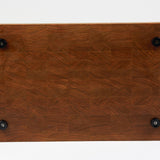 Cherry wood end grain cutting board with rich warm wood tones. Displaying a view of the bottom side with four cutting board feet.