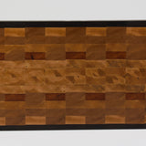 End grain cutting board made of rustic Hard Maple and accented with Tigerwood and Black Walnut. Straight on view of the cutting surface.