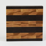 Luxurious Black Walnut and Maple cutting board, top view.