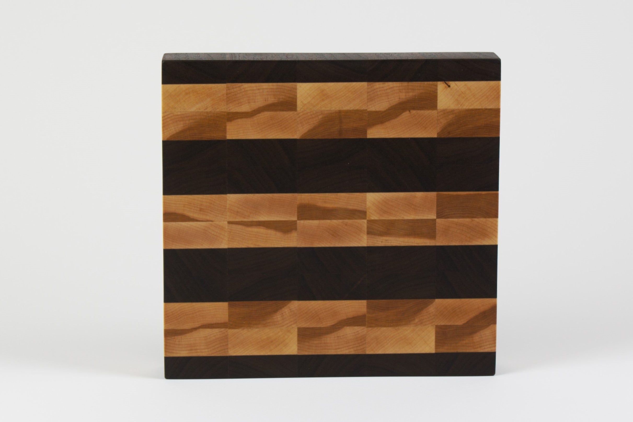 Luxurious Black Walnut and Maple cutting board, top view.