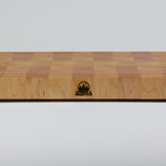 Classic Hard Maple cutting board with golden hues. The Timber & Tradition logo is burned into the center front, this is the front center view.