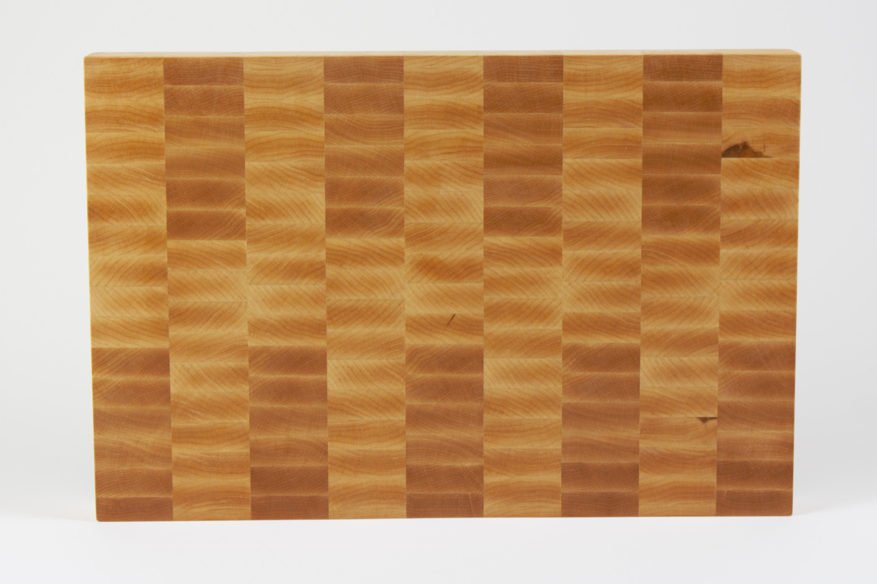 Classic Hard Maple cutting board with golden hues, straight on view of the cutting surface.