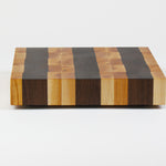 Luxurious Maple and Black Walnut cutting board, side view.