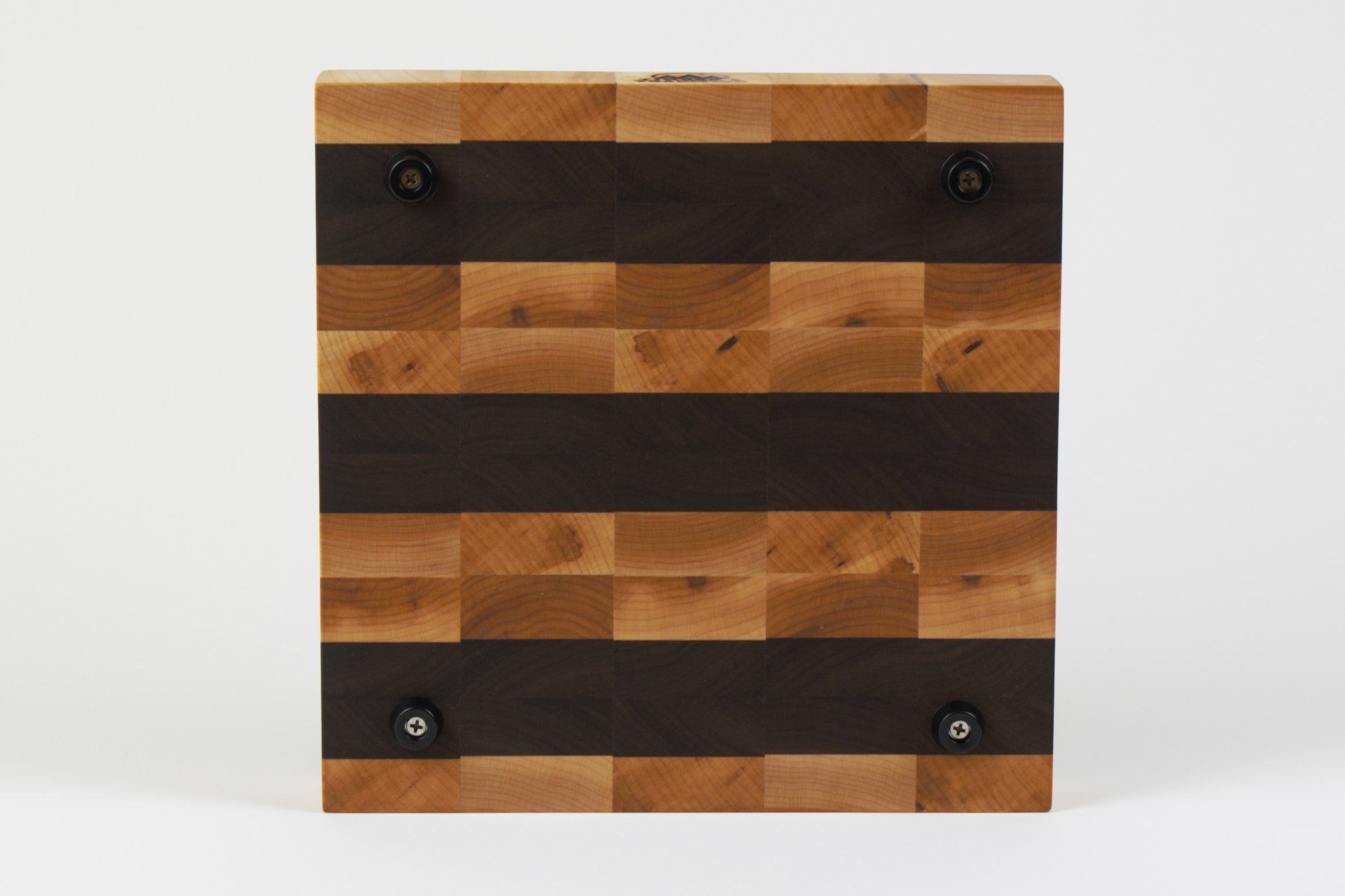 Luxurious Maple and Black Walnut cutting board, bottom view, displaying four cutting board feet.