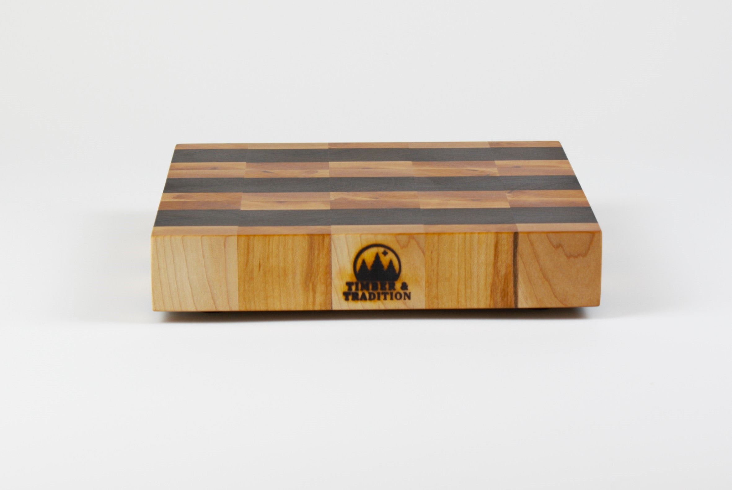 Luxurious Maple and Black Walnut cutting board, front view.