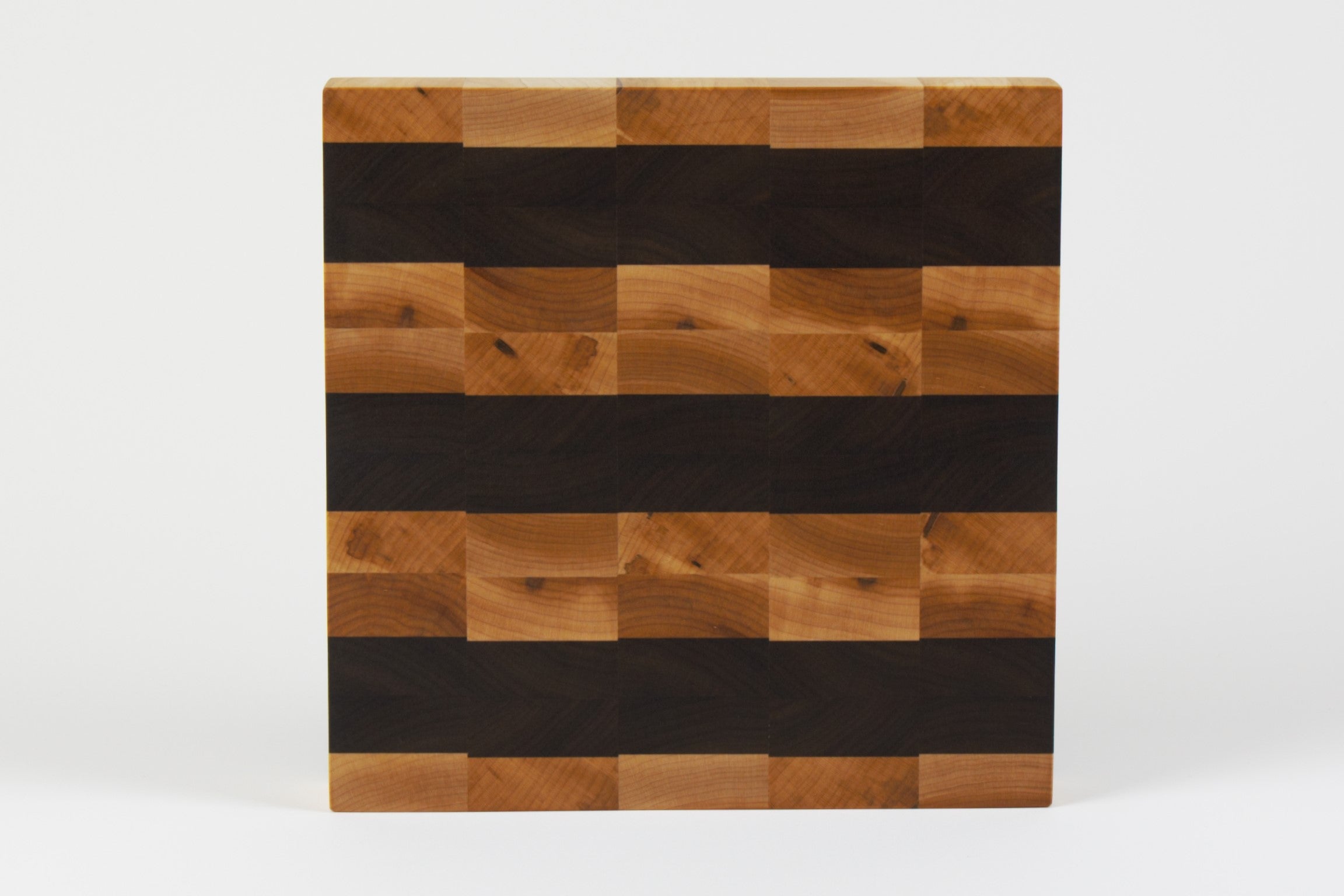 Luxurious Maple and Black Walnut cutting board, top view.