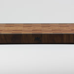 End grain cutting board made of rustic Hard Maple and accented with Tigerwood and Black Walnut. Front center view with the Timber & Tradition logo burned into front of board.