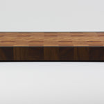 End grain cutting board made of rustic Hard Maple and accented with Tigerwood and Black Walnut, rear view.